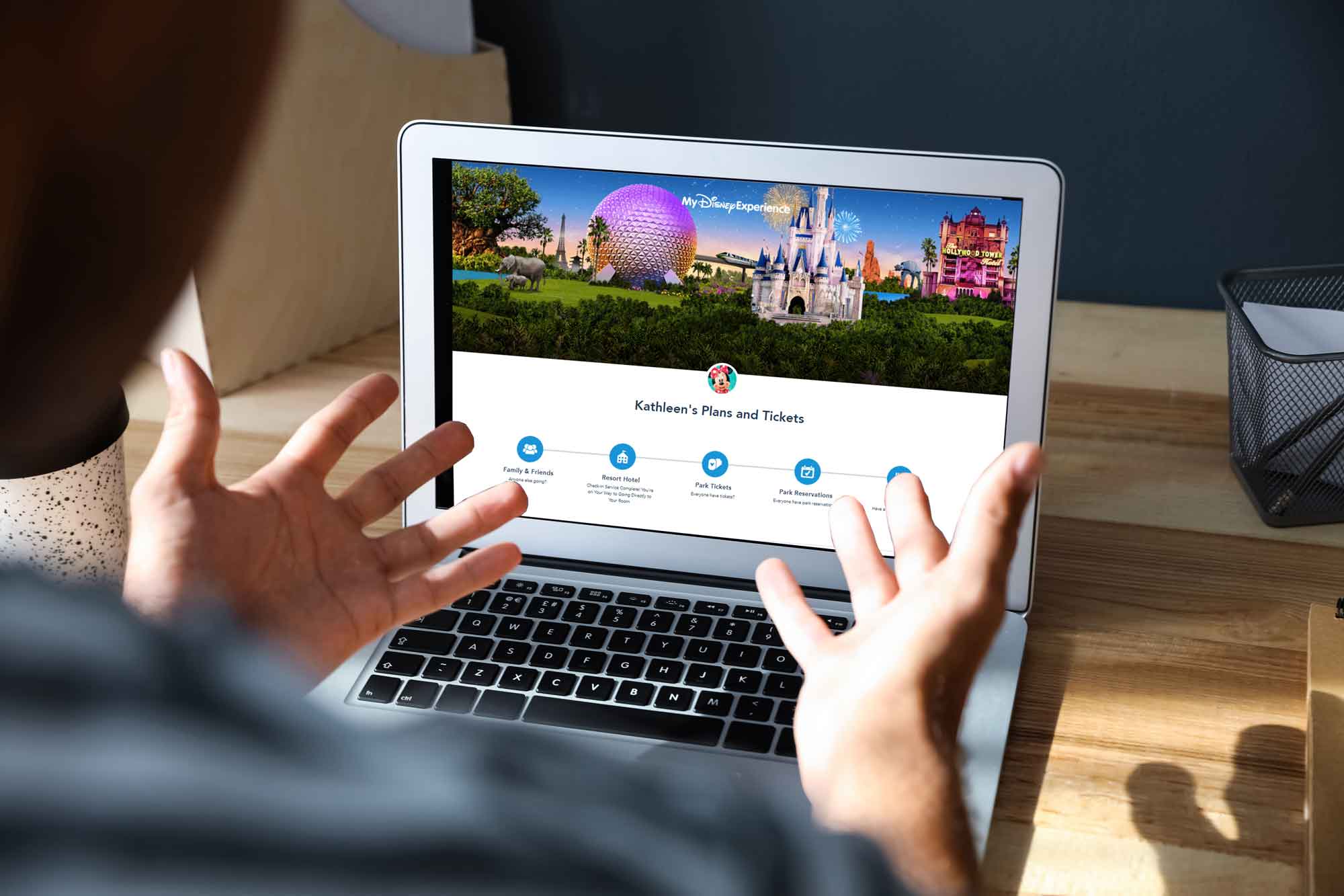frustrated traveler shaking hands at a computer screen, wishing they had contacted a travel agent specializing in Disney to book their vacation.