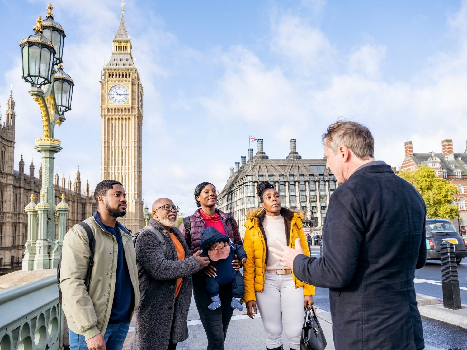 A guide leads a private travel tour with Big Ben in the background